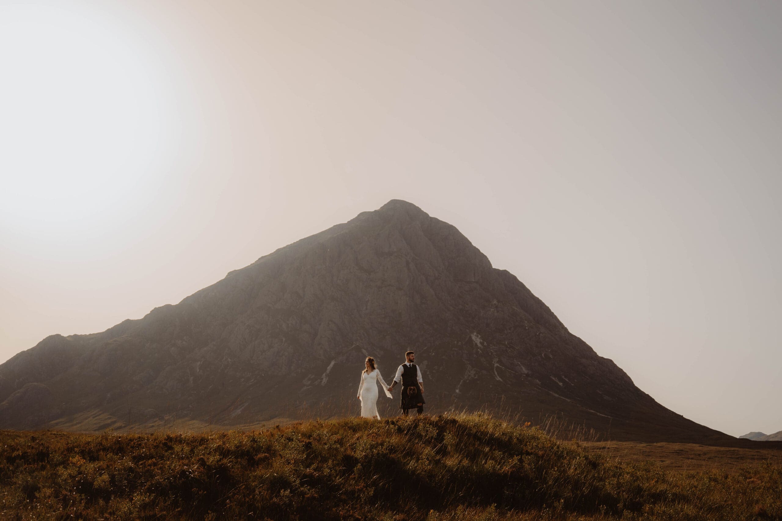 couple with mountain in glencoe on their elopement day